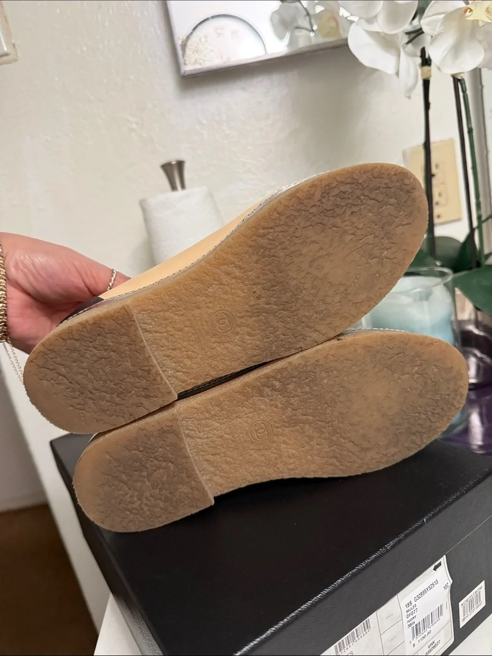 CHANEL Two-Tone Leather High-Top Sneakers in Beige & Black